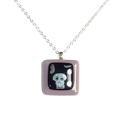 Dichroic silver skulls on purple fused glass necklace