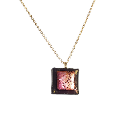 Pink and orange dichroic sundials on metallic black fused glass pendant necklace
