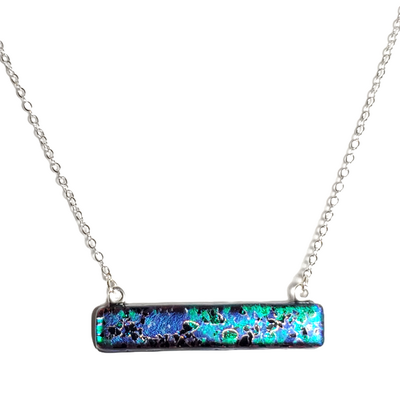 Dichroic blue green splatter on black fused glass bar necklace