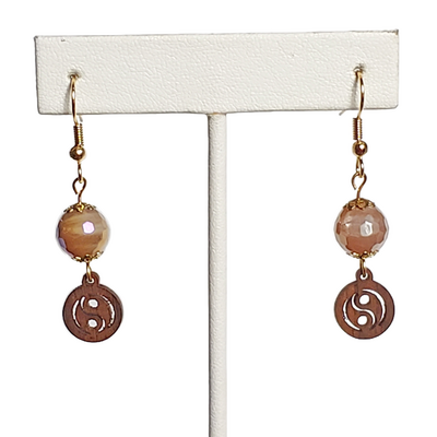 Wood yin yang and faceted taupe glass bead earrings