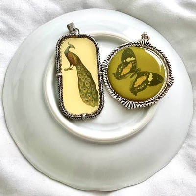Butterfly and peacock vintage style pendant set